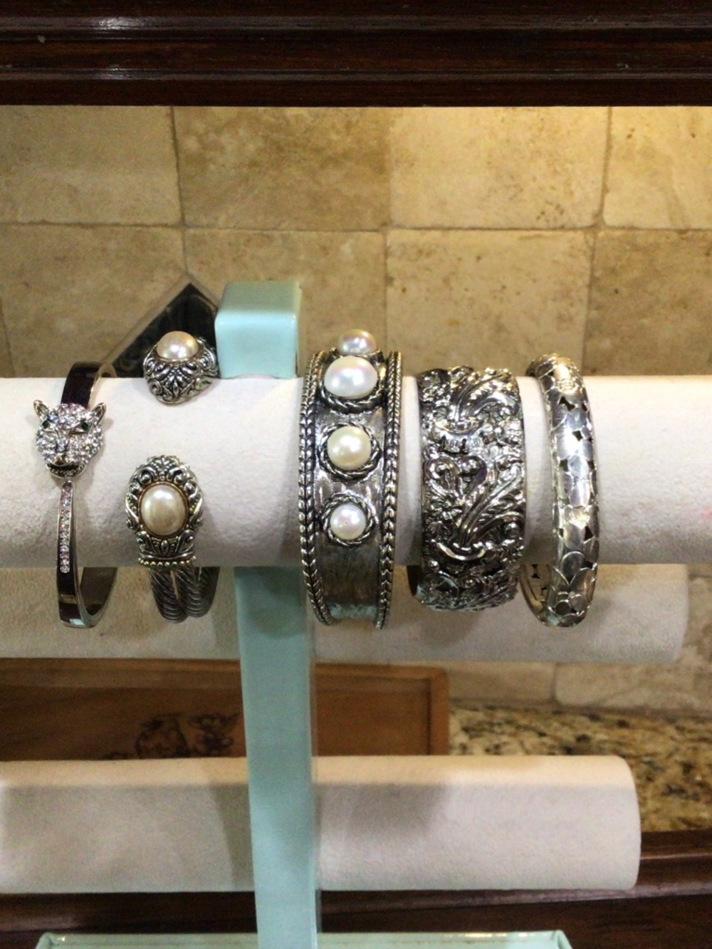 Five silvertone cuff bracelets. One is signed Best. All in great shape.